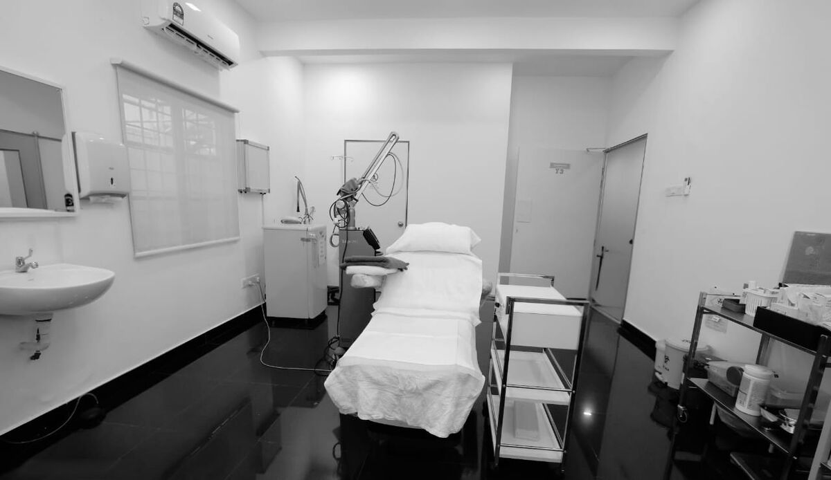 Laser and aesthetics bay at ARC Clinic with treatment bed