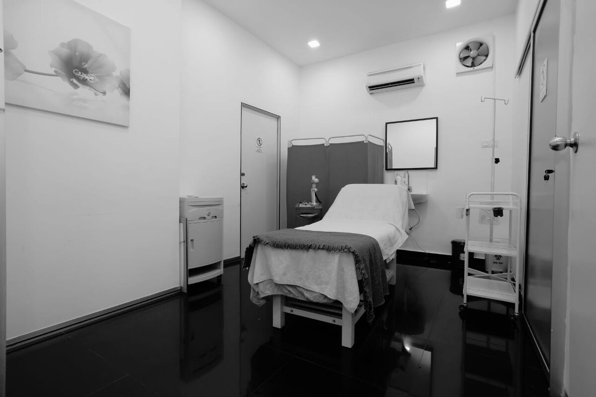 Recovery suite at ARC Clinic with bed and drip stand
